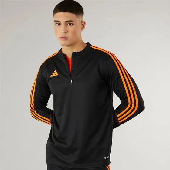 Offer: adidas Tiro 23 Club 1/4 Zip Training Top for Him in black/orange at the MandM store